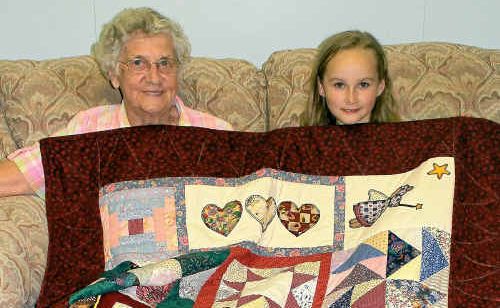 Mavis Stacey with the quilt she made for seven-year-old Mika Campbell. Mavis Stacey with the quilt she made for seven-year-old Mika Campbell.